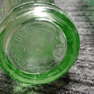 Two vintage Coca Cola Hobble Skirt Glass Soda Bottles marked LEESBURG FLA. - FLORIDA on base