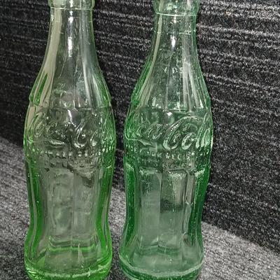 Two vintage Coca Cola Hobble Skirt Glass Soda Bottles marked LEESBURG FLA. - FLORIDA on base