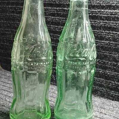 Two vintage Coca Cola Hobble Skirt Glass Soda Bottles marked LEESBURG FLA. - FLORIDA on base