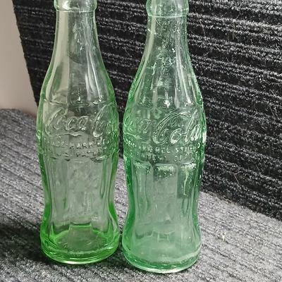 Two vintage Coca Cola Hobble Skirt Glass Soda Bottles marked LEESBURG FLA. - FLORIDA on base