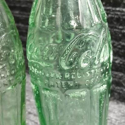 Two vintage Coca Cola Hobble Skirt Glass Soda Bottles marked LEESBURG FLA. - FLORIDA on base