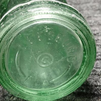 Two vintage Coca Cola Hobble Skirt Glass Soda Bottles marked LEESBURG FLA. - FLORIDA on base