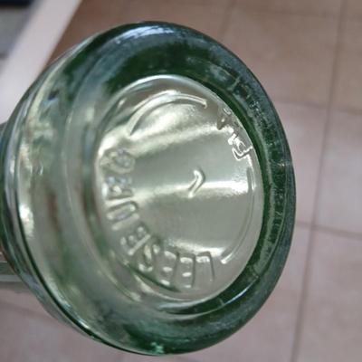 Two vintage Coca Cola Hobble Skirt Glass Soda Bottles marked LEESBURG FLA. - FLORIDA on base