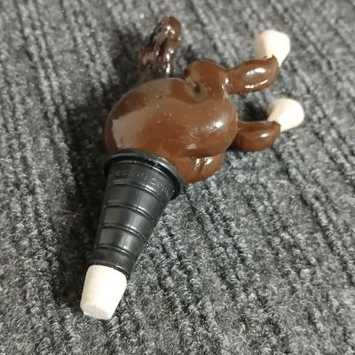 Empty Glass Frosted bottle with horse rear stopper and three glass ice cubes / clear glass cubes