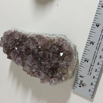 Amethyst slab and heart shaped Geode with shell looking outside.