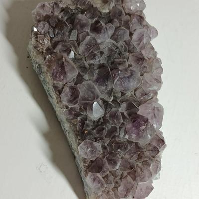 Amethyst slab and heart shaped Geode with shell looking outside.