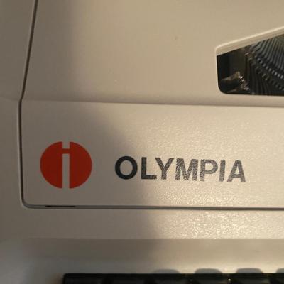 OLYMPIA MANUAL REPORTER TYPEWRITER AND AND PAPER