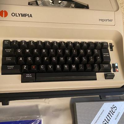OLYMPIA MANUAL REPORTER TYPEWRITER AND AND PAPER