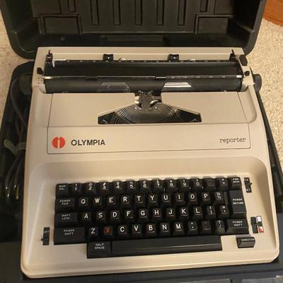 OLYMPIA MANUAL REPORTER TYPEWRITER AND AND PAPER