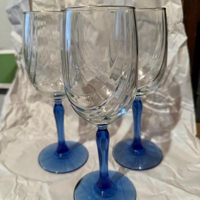 Lot of wine glasses with blue stem