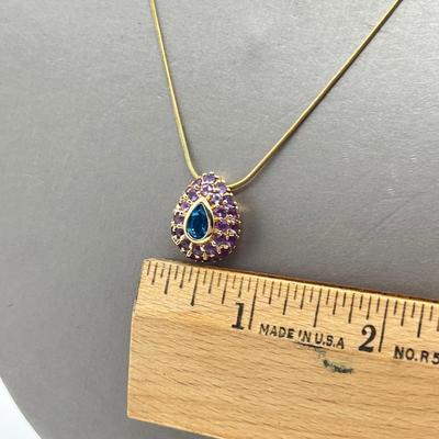 LOT 80: 14K Yellow Gold Amethyst and Blue Topaz Pendant on 20" Chain
