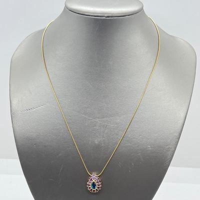 LOT 80: 14K Yellow Gold Amethyst and Blue Topaz Pendant on 20" Chain