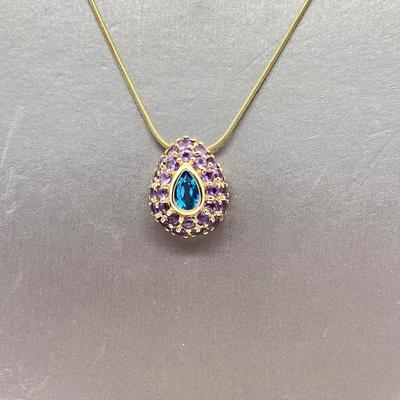 LOT 80: 14K Yellow Gold Amethyst and Blue Topaz Pendant on 20" Chain