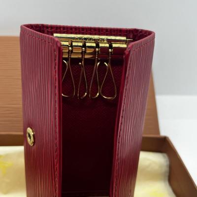 LOT 103: Collection of International Currency and New In Box Louis Vuitton Key Holder Wallet