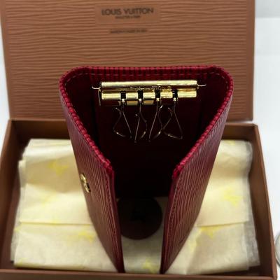 LOT 103: Collection of International Currency and New In Box Louis Vuitton Key Holder Wallet
