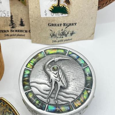 LOT 121: Pewter Nantucket Scrimshaw Basket Pendant, Dyed Oval Howlite Pendant, Two Art Glass Pendants, Fifteen Puzzle and More!