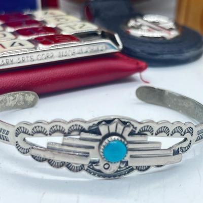 LOT 121: Pewter Nantucket Scrimshaw Basket Pendant, Dyed Oval Howlite Pendant, Two Art Glass Pendants, Fifteen Puzzle and More!