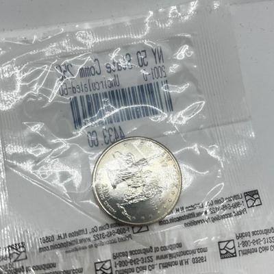 LOT 126: Four Uncirculated Sacagawea Coins and Uncirculated State Quarters