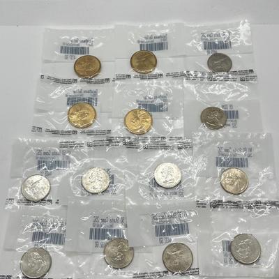 LOT 126: Four Uncirculated Sacagawea Coins and Uncirculated State Quarters