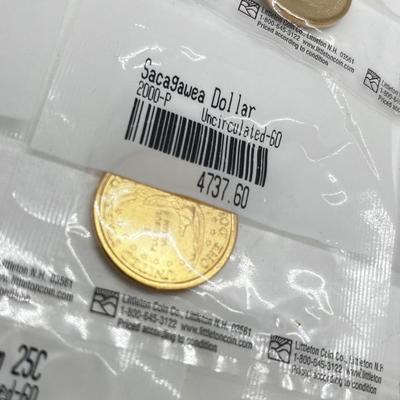 LOT 126: Four Uncirculated Sacagawea Coins and Uncirculated State Quarters