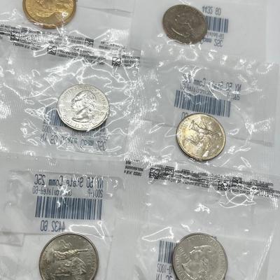 LOT 126: Four Uncirculated Sacagawea Coins and Uncirculated State Quarters