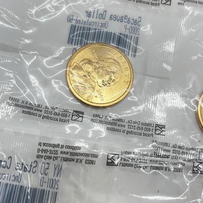 LOT 126: Four Uncirculated Sacagawea Coins and Uncirculated State Quarters