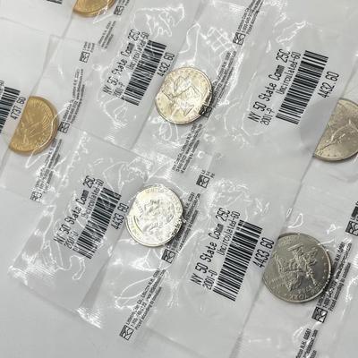 LOT 126: Four Uncirculated Sacagawea Coins and Uncirculated State Quarters