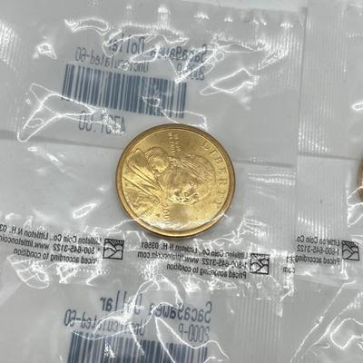 LOT 126: Four Uncirculated Sacagawea Coins and Uncirculated State Quarters