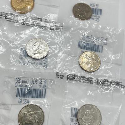 LOT 126: Four Uncirculated Sacagawea Coins and Uncirculated State Quarters