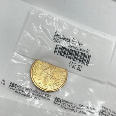 LOT 126: Four Uncirculated Sacagawea Coins and Uncirculated State Quarters