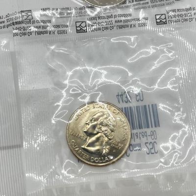 LOT 126: Four Uncirculated Sacagawea Coins and Uncirculated State Quarters