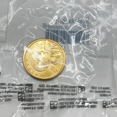 LOT 126: Four Uncirculated Sacagawea Coins and Uncirculated State Quarters