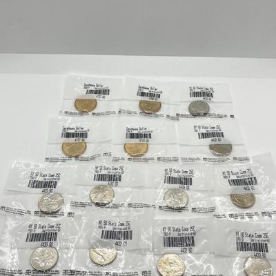 LOT 126: Four Uncirculated Sacagawea Coins and Uncirculated State Quarters