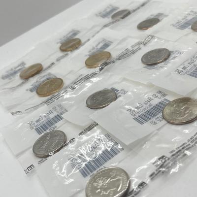 LOT 126: Four Uncirculated Sacagawea Coins and Uncirculated State Quarters