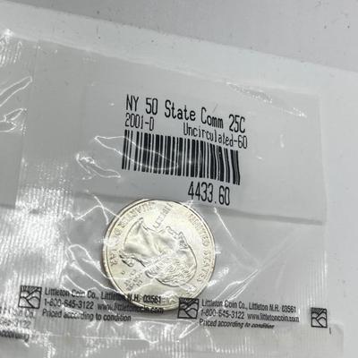 LOT 126: Four Uncirculated Sacagawea Coins and Uncirculated State Quarters