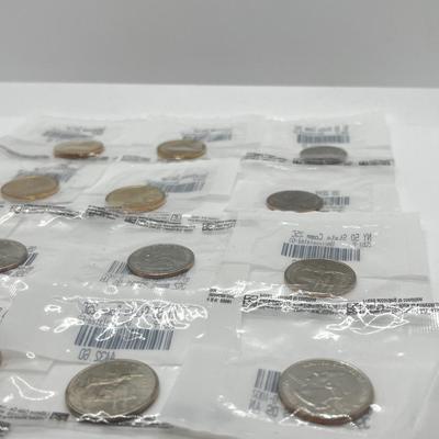 LOT 126: Four Uncirculated Sacagawea Coins and Uncirculated State Quarters