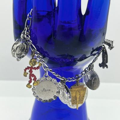 LOT 127: Vintage Sterling Charm Bracelet With Some Sterling Charms