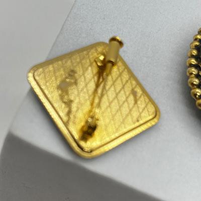 LOT 131: Two Damascene Square Brooches/Pins With Trombone Clasps, Cameo Brooch/Pin, and "Blue He" Shoe Clips