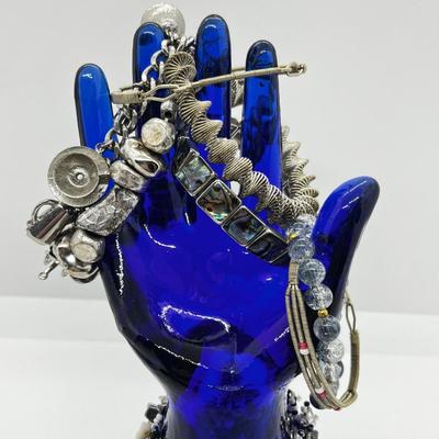 LOT 142: Collection of Unique Bracelets With Cool Fabric Box