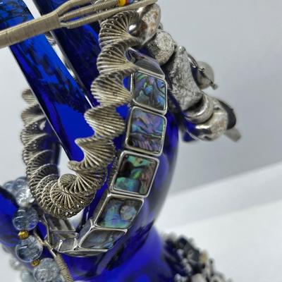 LOT 142: Collection of Unique Bracelets With Cool Fabric Box