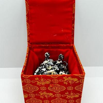 LOT 142: Collection of Unique Bracelets With Cool Fabric Box