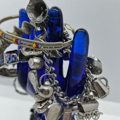 LOT 142: Collection of Unique Bracelets With Cool Fabric Box
