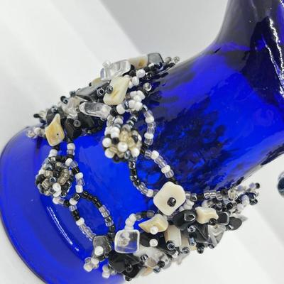 LOT 142: Collection of Unique Bracelets With Cool Fabric Box