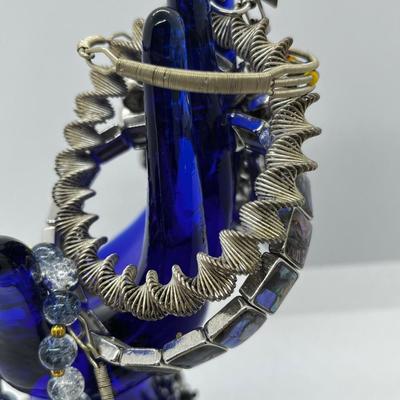 LOT 142: Collection of Unique Bracelets With Cool Fabric Box