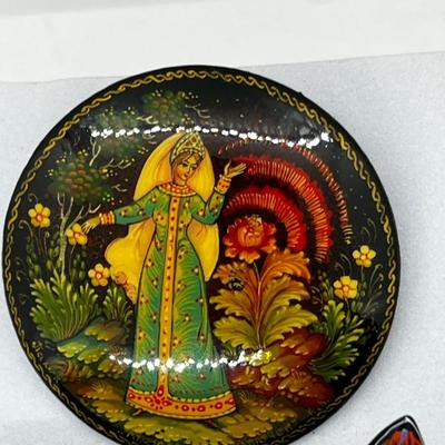 LOT 160: Russian Hand Painted Black Lacquer Brooches and Swan Trinket Box