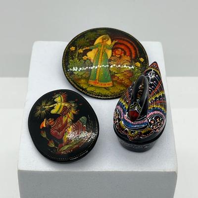 LOT 160: Russian Hand Painted Black Lacquer Brooches and Swan Trinket Box