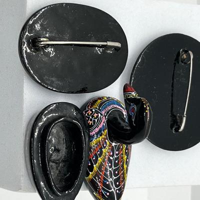 LOT 160: Russian Hand Painted Black Lacquer Brooches and Swan Trinket Box