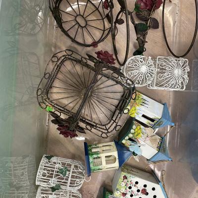 Faux flowers and bird houses and baskets