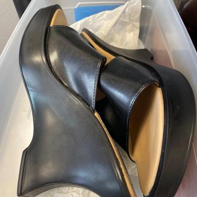 Mostly black shoes and boots