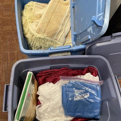 2 totes of throws and table clothes